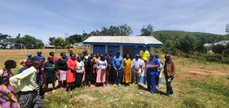 School Committee & Community Members During The Launch of a Renovated Latrine
